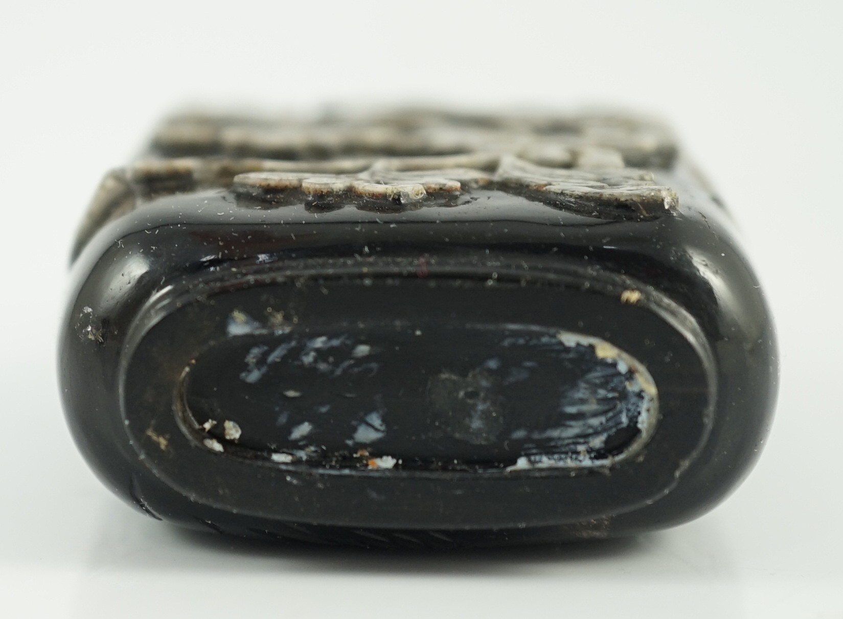 A Chinese smoky quartz snuff bottle, 1780-1820, 6.7cm high, coral stopper